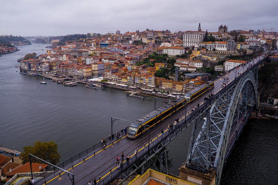 Train crossing Dom Luis I bridge Porto