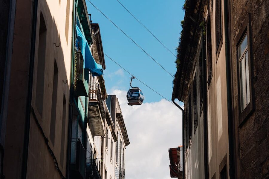 Cable car between historic buildings in Porto Vila Nova de Gaia