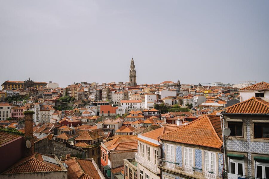 Red rooftops of Porto with Torre dos Clerigos in distance