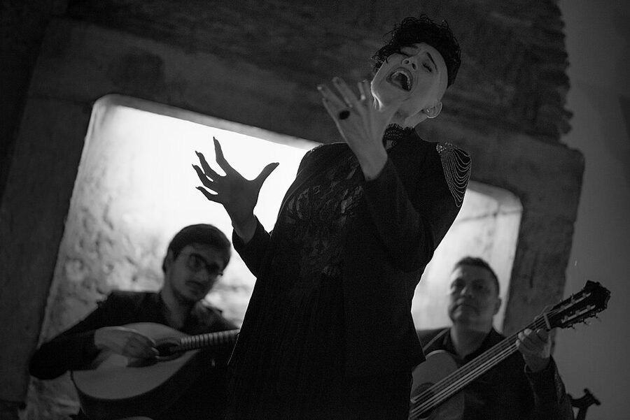 Fadista performing a Portuguese fado song