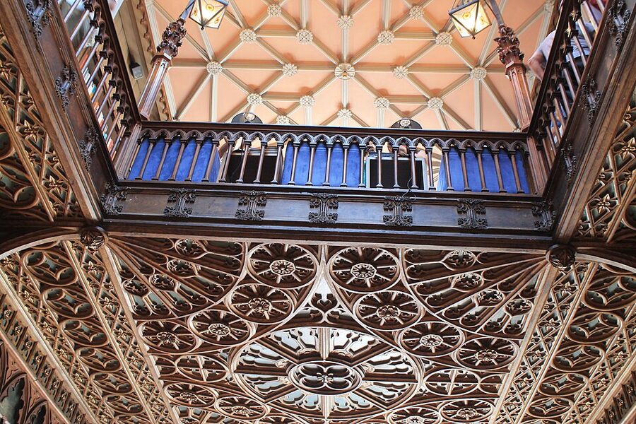Carved wood bookshelves at Livraria Lello