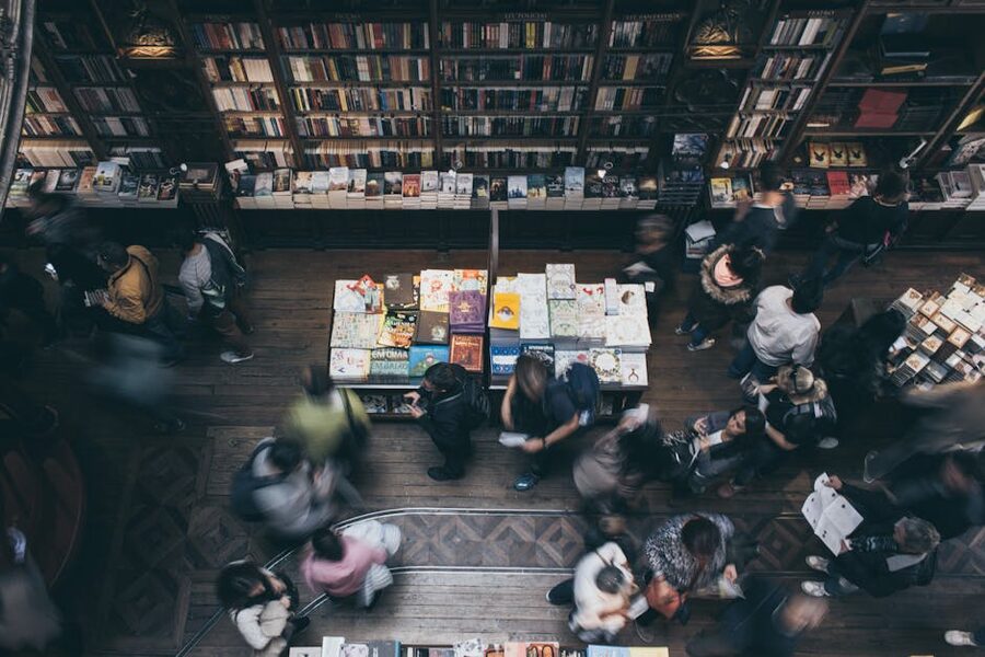 Crowds browsing shelves inside Livraria Lello bookshop in Porto