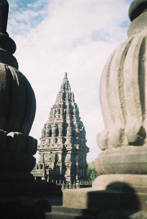 Prambanan Hindu temple spires framed by stone gateway