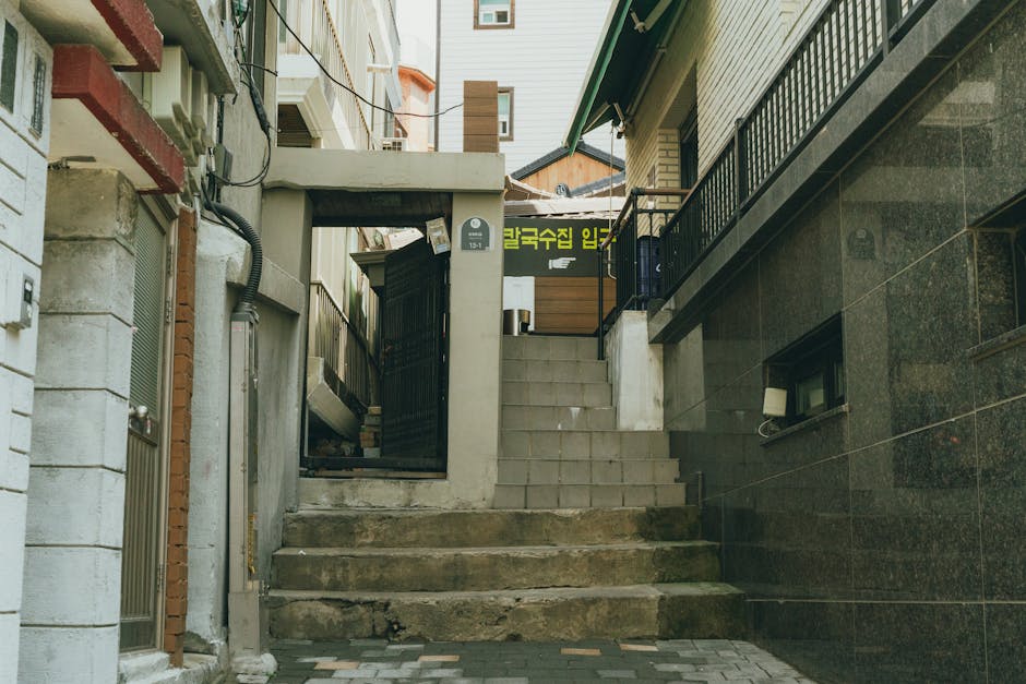 Narrow Seoul alley with old shopfronts and vintage signs