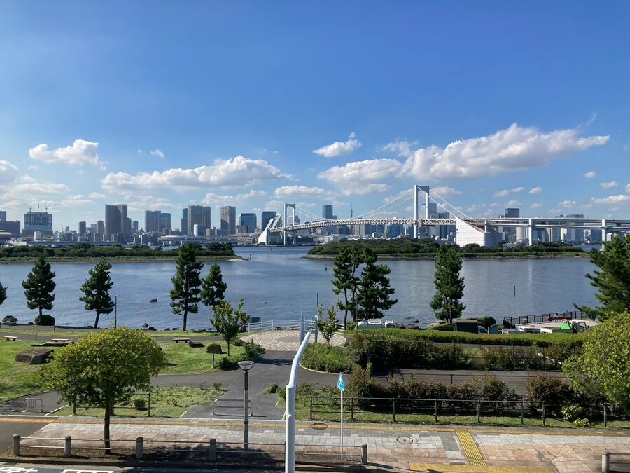 Rainbow Bridge spanning Tokyo Bay with the Tokyo skyline in the background on a clear day