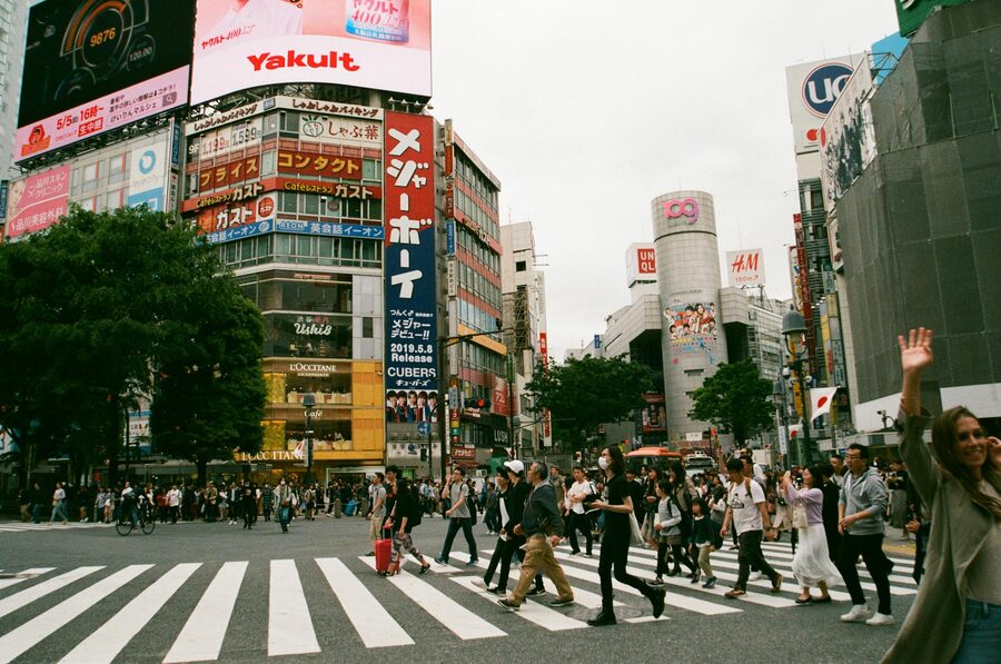 Hundreds of pedestrians crossing the famous Shibuya scramble crossing in Tokyo Japan