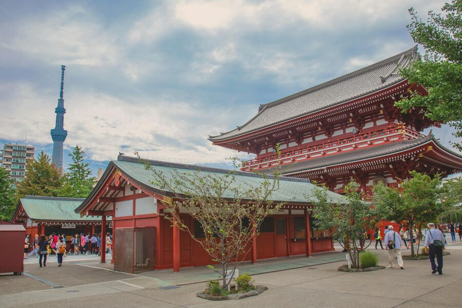 Sensoji Temple pagoda and main hall with Tokyo Skytree tower rising in the background in Asakusa