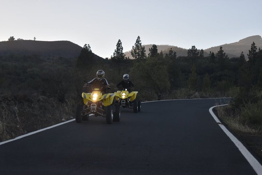 Quad bikes on Tenerife mountain road at dusk