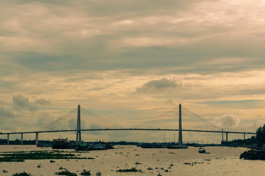 Sunset over Rach Mieu Bridge and river in My Tho Vietnam