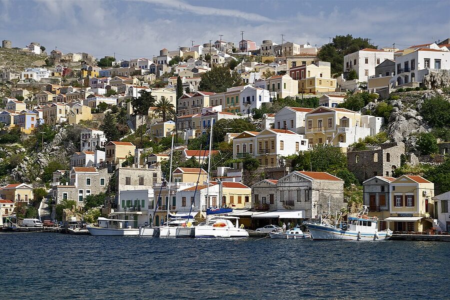 Symi pastel tiered houses neoclassical Greece