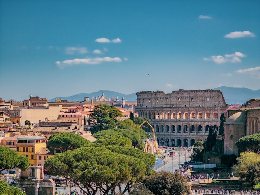 Aerial view of Rome rooftops with the Colosseum visible