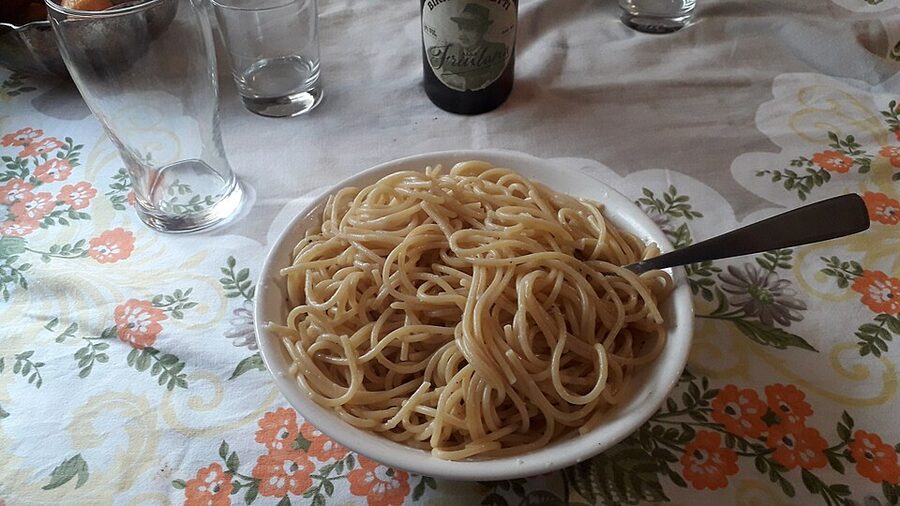 Spaghetti cacio e pepe twirled on fork in Rome
