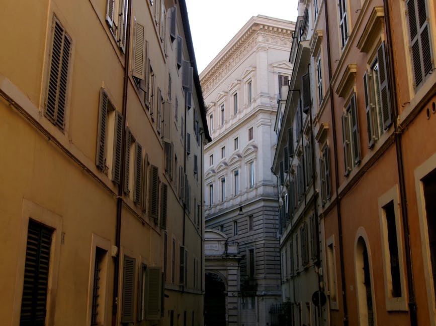 Narrow alley in central Rome with historic buildings