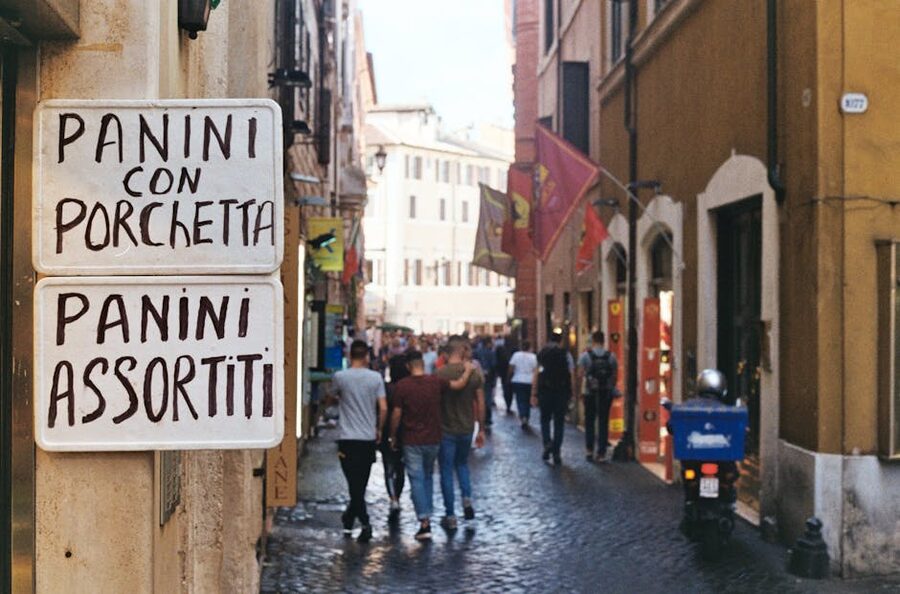 Panini sign in narrow Rome alley