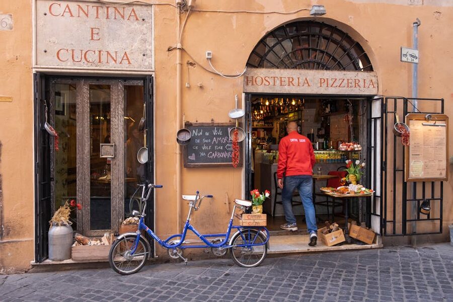 Rome pizzeria entrance with blue bicycle