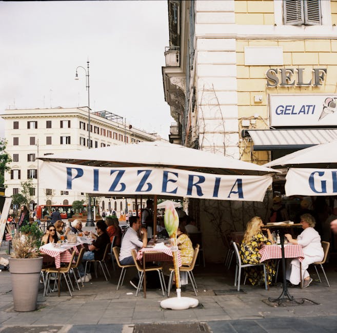 People dining outside a Rome pizzeria