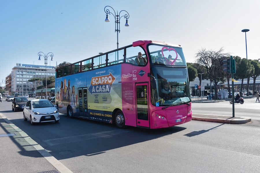 Tour bus passing Piazza Venezia in Rome