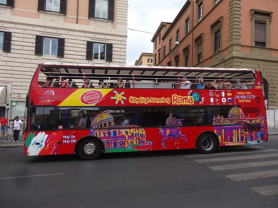 Sightseeing bus on Via Liberiana near Santa Maria Maggiore Rome