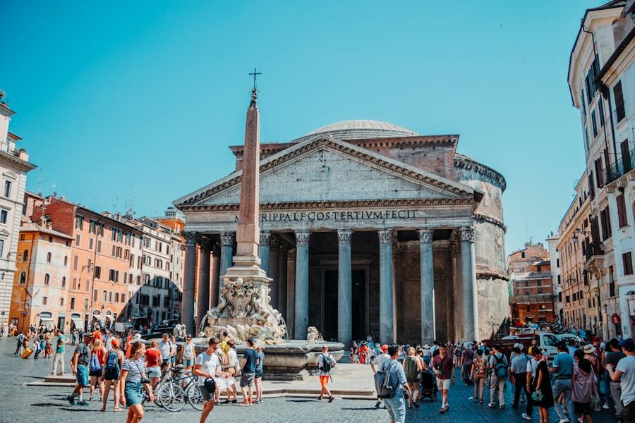 Visitors walking in front of Pantheon Rome on a sunny day