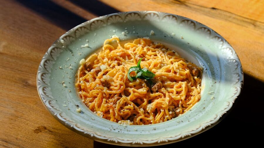 Plate of spaghetti carbonara at an outdoor Roman restaurant