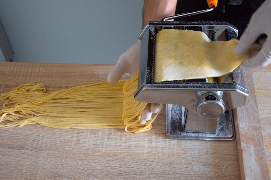 Pasta machine producing fresh spaghetti in a Roman kitchen