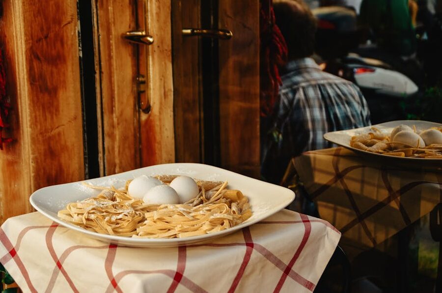 Plate of fresh egg pasta on display outside a Rome restaurant