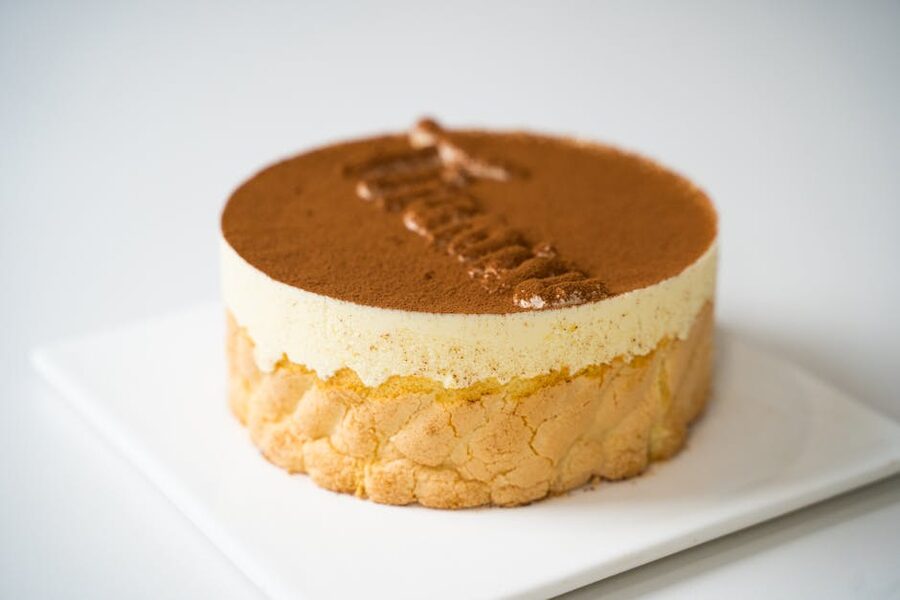 Plated tiramisu with cocoa dusting and creamy layers