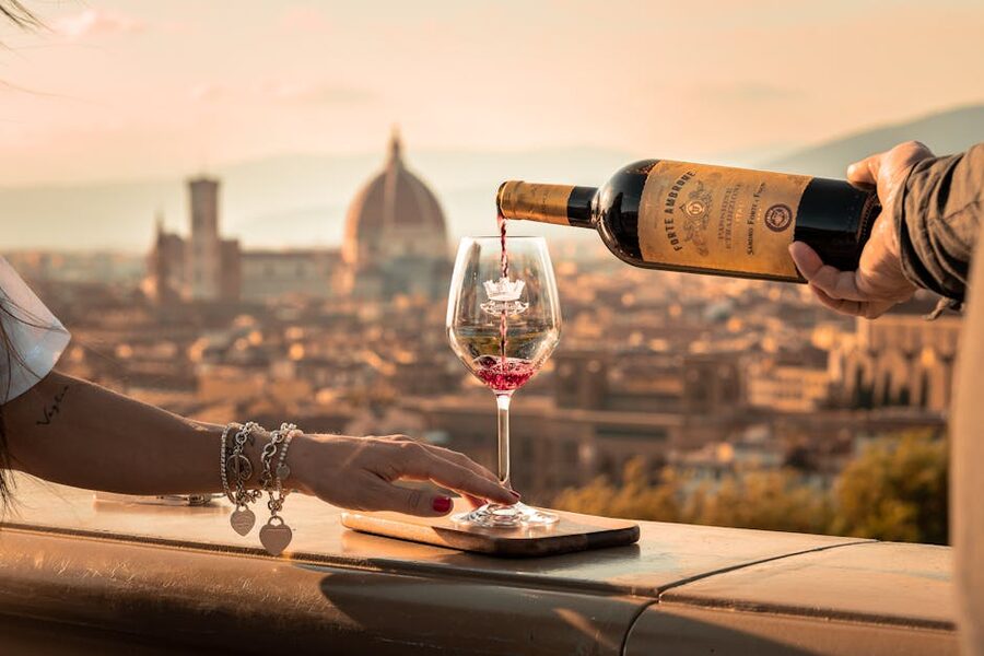 Wine being poured during an Italian evening class meal