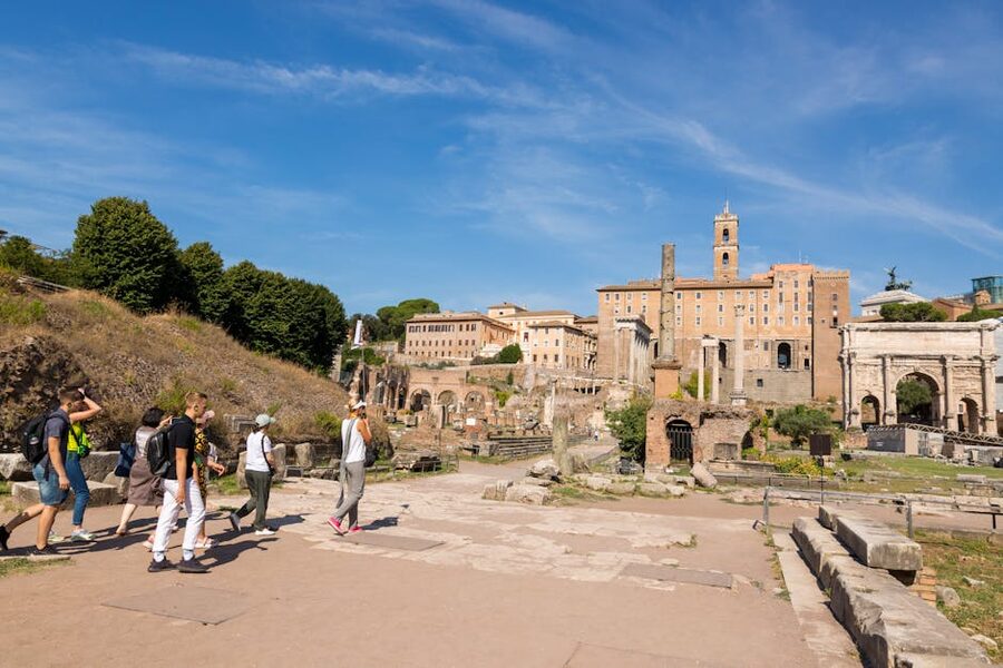 Tourists exploring Roman Forum on a sunny day