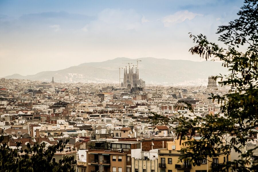 Sagrada Familia panorama with Barcelona old town rooftops