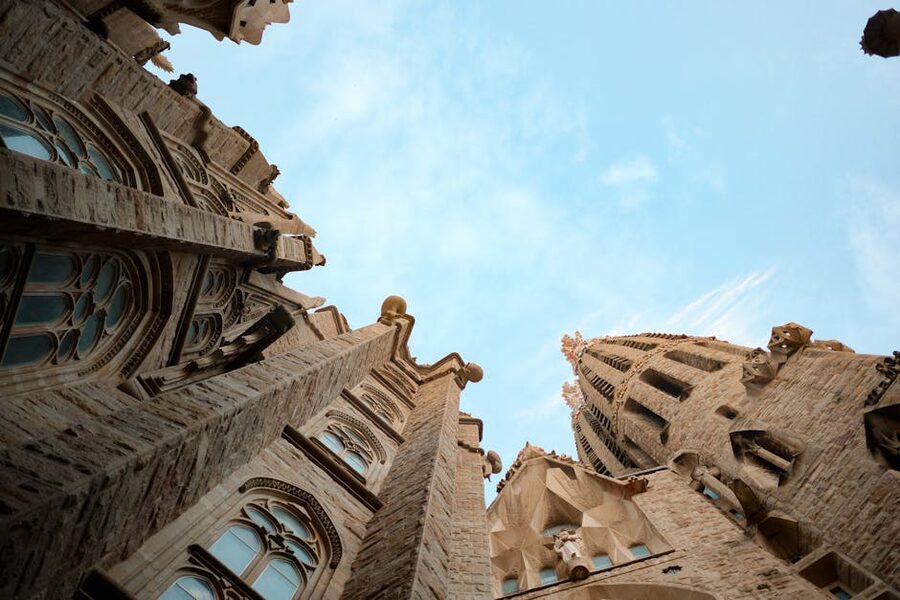 Sagrada Familia towers against blue sky upward view