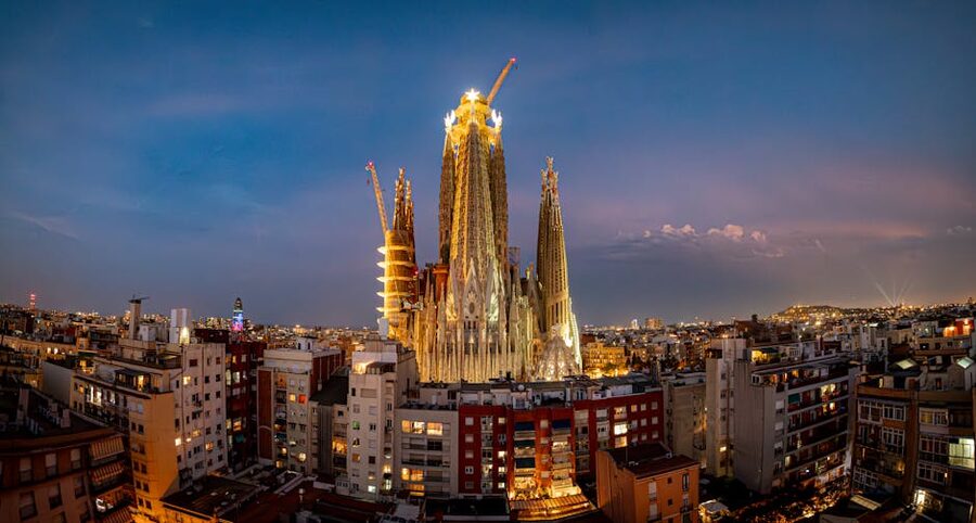 Sagrada Familia illuminated at twilight aerial view Barcelona
