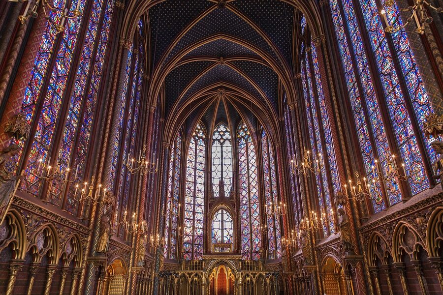 Sainte-Chapelle interior arches with chandeliers and stained glass windows