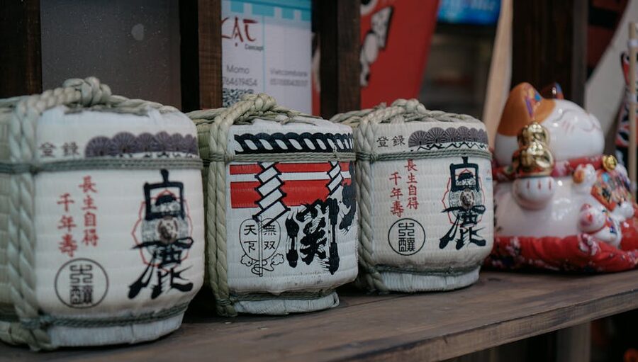 Sake being poured into ceramic cup Japan
