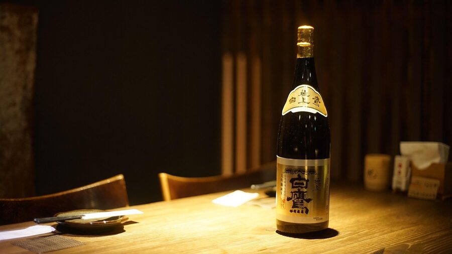 Traditional sake bottles and cups with Japanese kaiseki cuisine