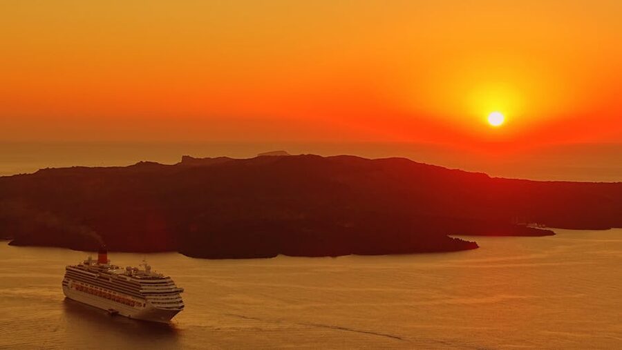Cruise ship Santorini calm sunset sea late evening