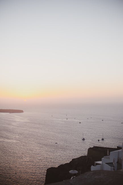 Santorini sunset Aegean Sea boats silhouette