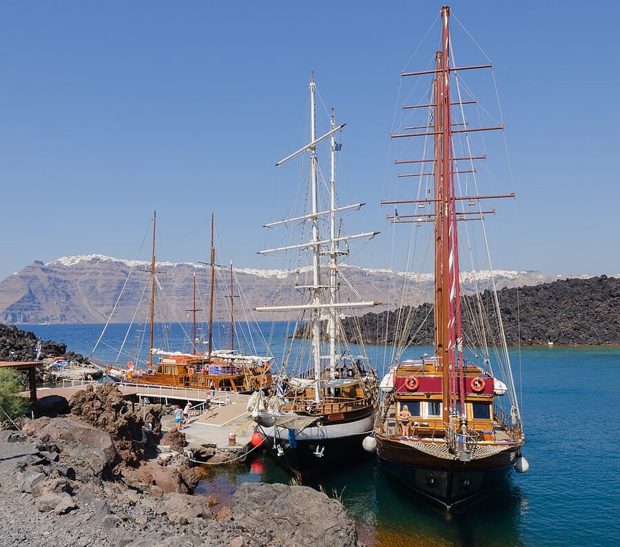 Nea Kameni tour boats arriving Santorini volcanic island