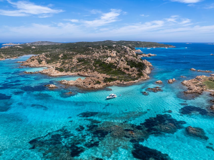 Aerial of yacht and coastline at La Maddalena