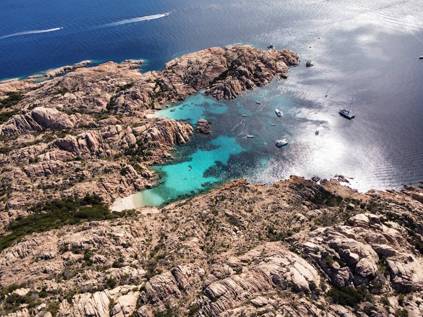 Aerial view of turquoise water around the La Maddalena Archipelago coastline