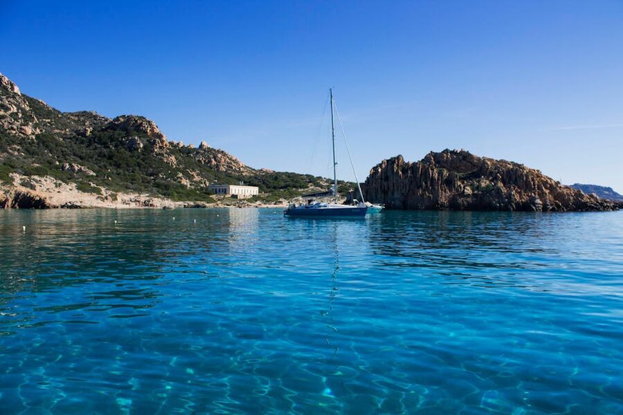 Sailboat in clear blue water at La Maddalena