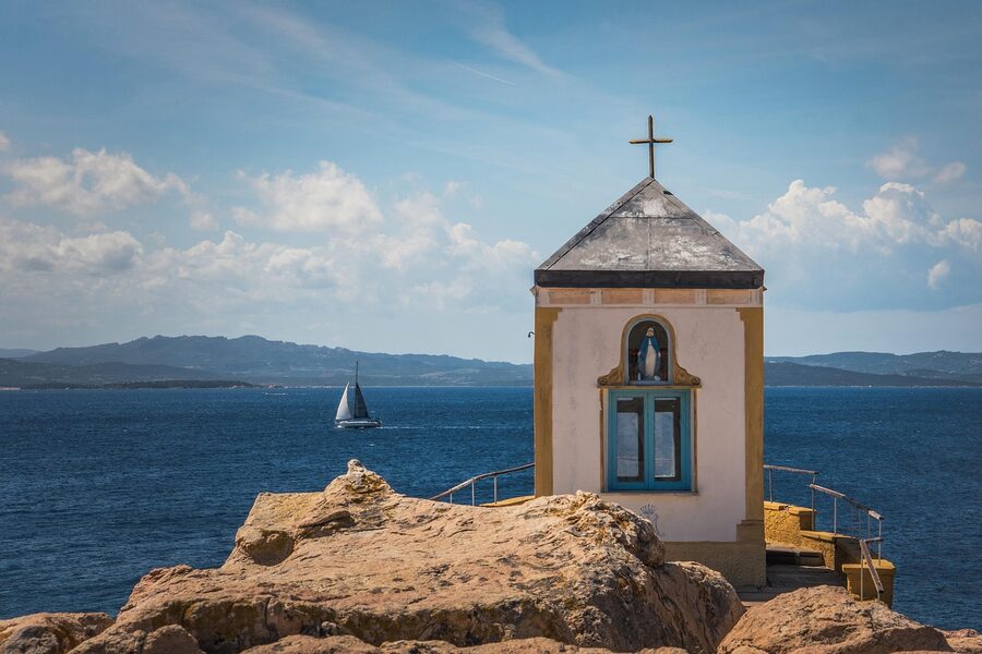 Church in La Maddalena town with sea in the background