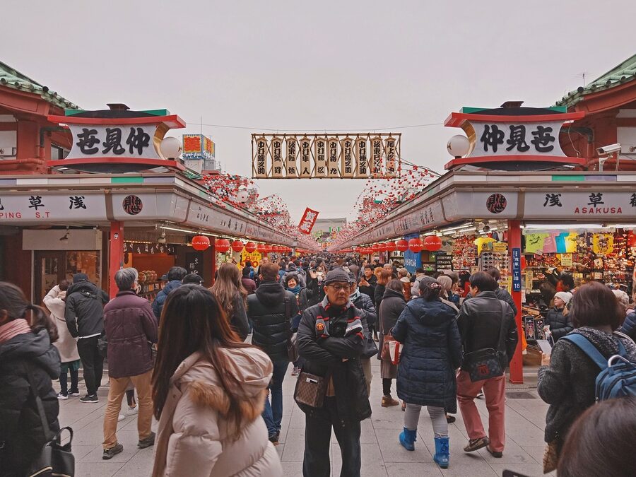 Crowds of travelers at Sensoji Temple complex in Asakusa