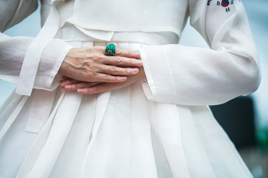 Hanbok detail with emerald ring