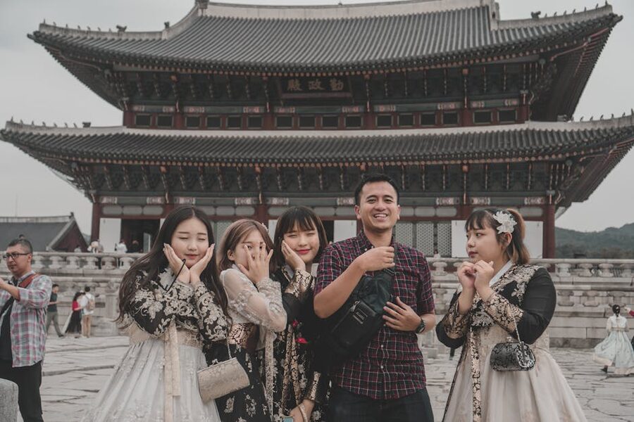 Tourists posing at Gyeongbokgung Palace