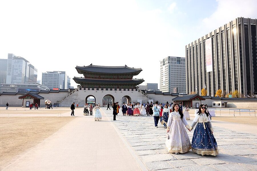Group of visitors wearing hanbok at Gyeongbokgung Palace