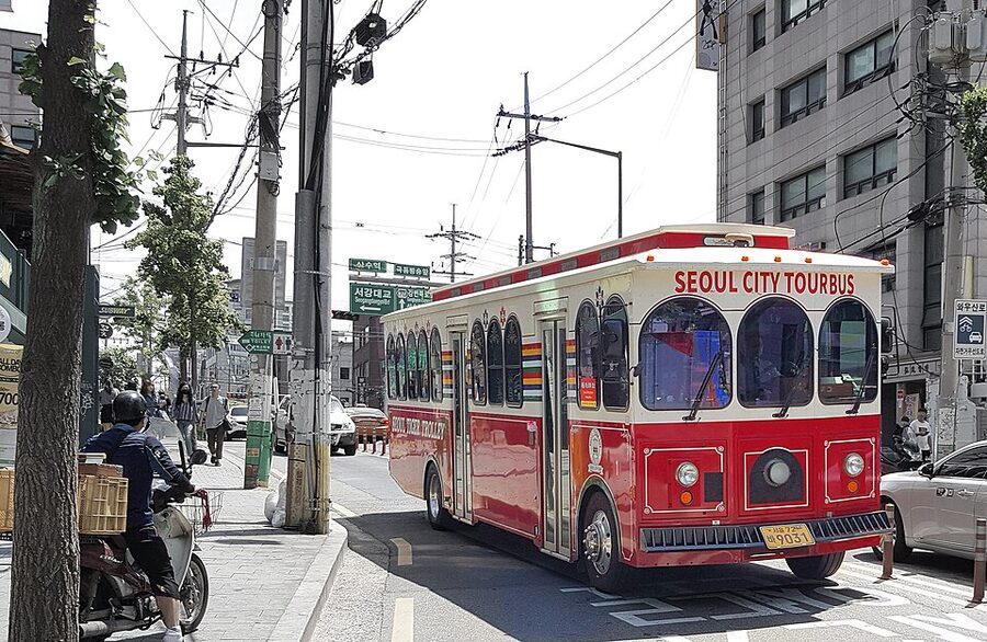 Seoul City Tour Bus trolley style vehicle in traffic