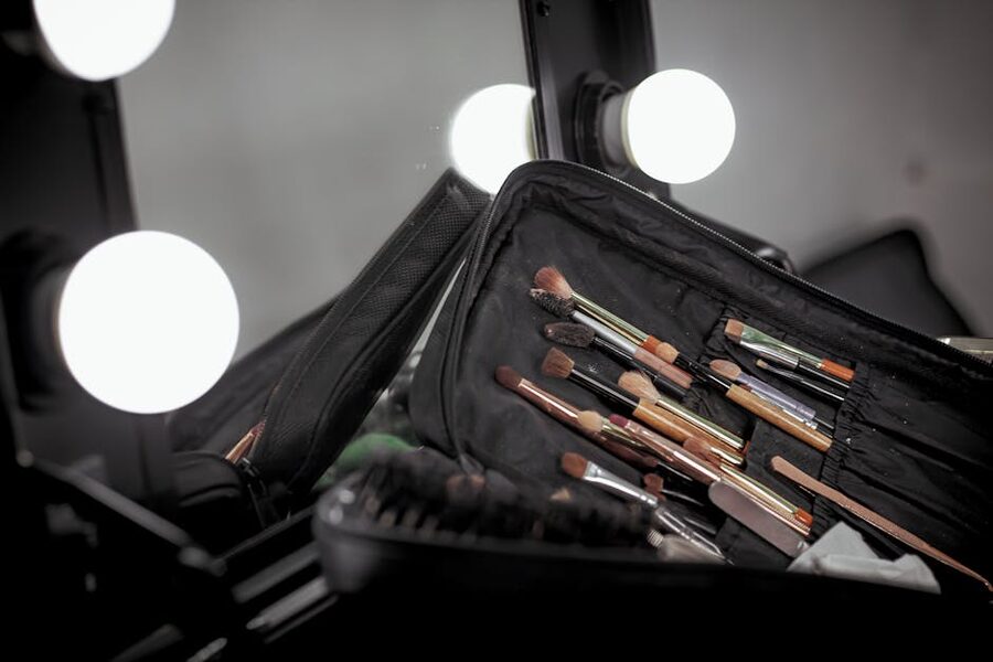 Makeup brushes laid out on a vanity table for a Seoul color analysis session