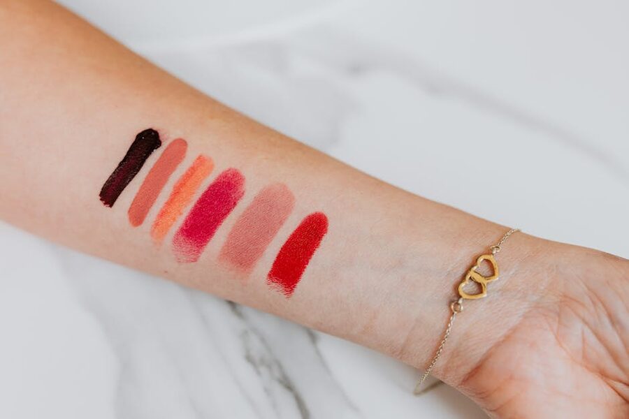 Lipstick shade swatches tested on the forearm at a Seoul makeup session