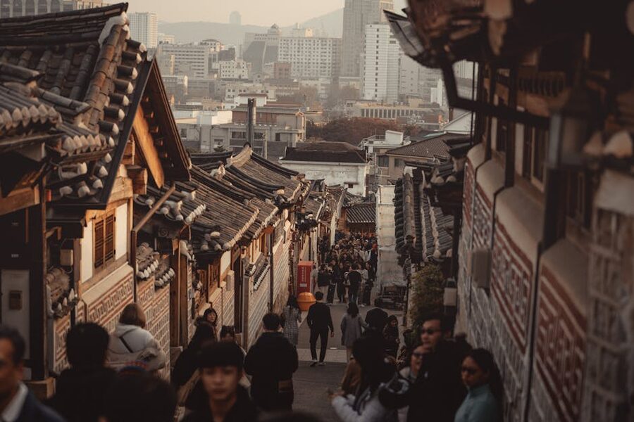 Crowded alley between traditional hanok houses in Bukchon